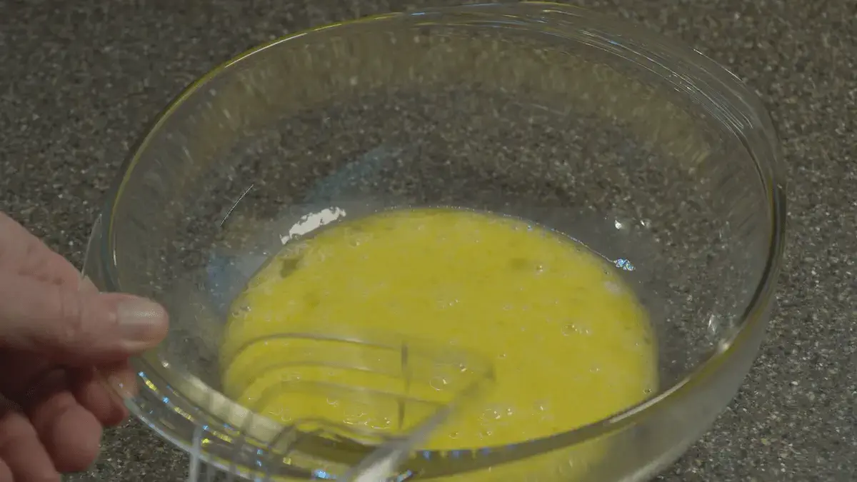 Glass bowl with whisked eggs